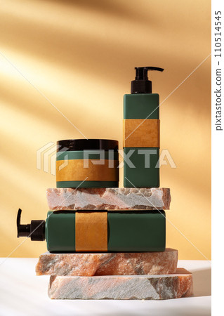 Cosmetic package dispenser with granite stone studio shot Cosmetic package dispenser with granite stone studio shot 110514545
