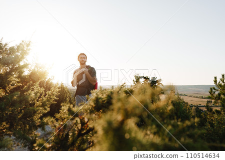 Portrait of hiker man with backpack trekking in the mountains 110514634