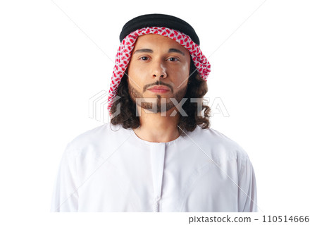 Portrait of a young Arab man wearing middle-eastern traditional dress thobe isolated on white Portrait of a young Arab man wearing middle-eastern traditional dress thobe isolated on white 110514666