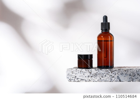 Cosmetic products packages and granite stone studio shot 110514684