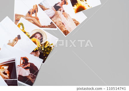 Printed colorful photos of women portraits against gray background Printed colorful photos of women portraits against gray background 110514741