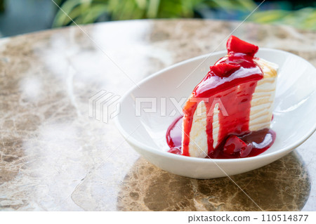 vanilla crepe cake with raspberry and strawberry sauce 110514877