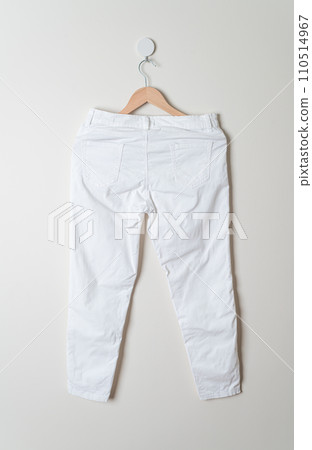 trousers or long pants hanging on wall 110514967