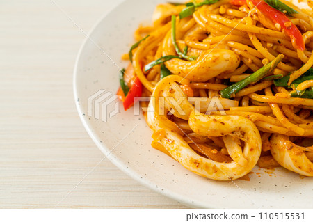 stir-fried spaghetti with salted egg and squid stir-fried spaghetti with salted egg and squid 110515531