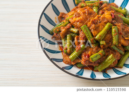 Stir fried pork with red curry paste 110515598