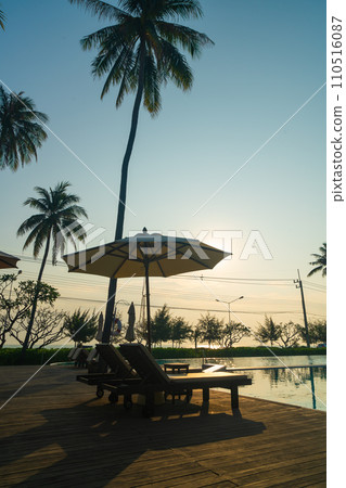 umbrella with bed pool around swimming pool with ocean sea background 110516087