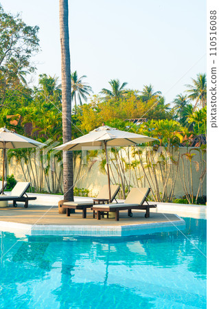 umbrella with bed pool around swimming pool with ocean sea background 110516088