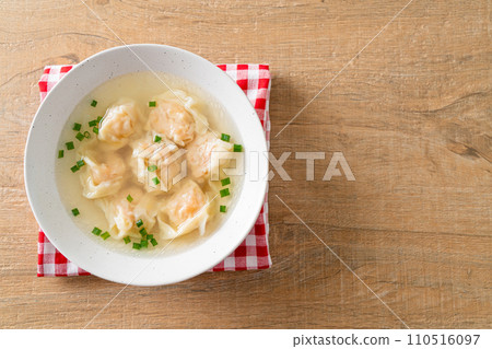 shrimp dumpling soup in white bowl 110516097