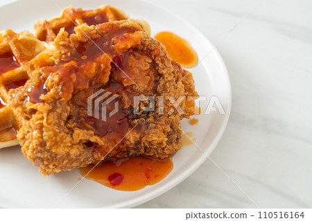 fried chicken with waffle and spicy sauce 110516164