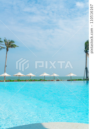 umbrella with bed pool around swimming pool with ocean sea background umbrella with bed pool around swimming pool with ocean sea background 110516167
