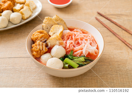 small flat rice noodles with fish balls and shrimp balls in pink soup, Yen Ta Four or Yen Ta Fo 110516192