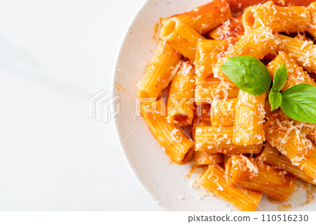 Rigatoni pasta with tomato sauce and cheese Rigatoni pasta with tomato sauce and cheese 110516230