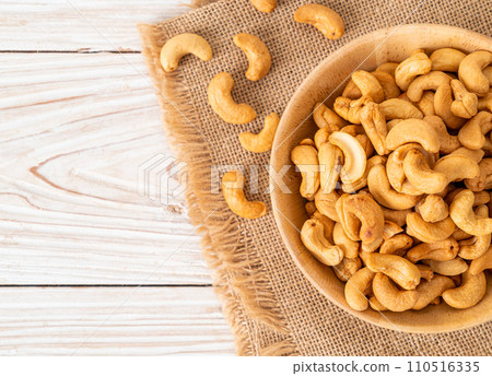 Cashew nuts in wooden bowl Cashew nuts in wooden bowl 110516335