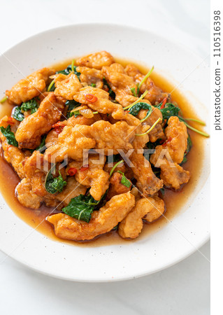 stir-fried fried fish with basil and chili in thai style 110516398