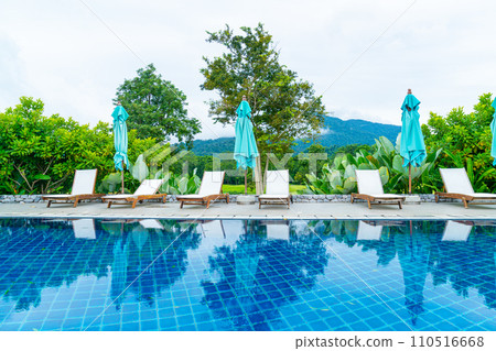 pool bed around swimming pool with mountain hill background pool bed around swimming pool with mountain hill background 110516668