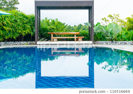 empty wood bench on poolside empty wood bench on poolside 110516669