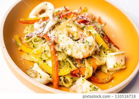 fettuccini spaghetti pesto seafood on plate fettuccini spaghetti pesto seafood on plate 110516718