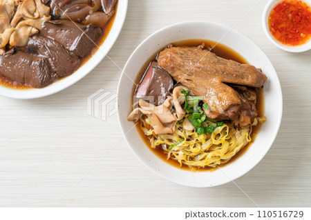 egg noodles with stewed and braised duck in brown soup egg noodles with stewed and braised duck in brown soup 110516729