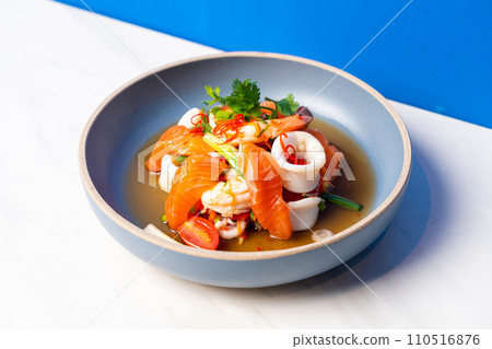 salmon and seafood spicy salad 110516876