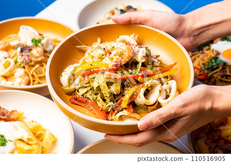 fettuccini spaghetti pesto seafood on plate fettuccini spaghetti pesto seafood on plate 110516905