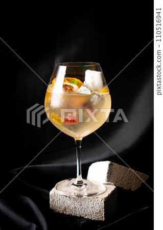 cocktail - white wine, tequila, triple,aromatic bitter, orange bitter, lime juice, syrup, topping with jelly and marshmello and mixed fruits 110516941