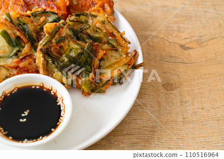 Pajeon or Korean pancake and Korean Kimchi pancake or Kimchijeon on white background 110516964