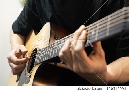 man playing acoustic guitar man playing acoustic guitar 110516994