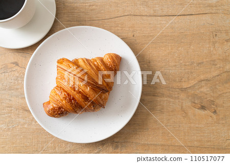 fresh croissant on white plate 110517077