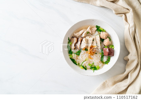 Vietnamese Rice Noodles Soup with Vietnamese Sausage served vegetables and crispy onion 110517162