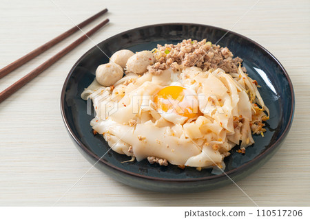 dried spicy noodles with minced pork, meatballs and egg 110517206