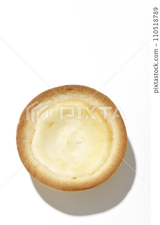 An overhead shot of a bite-sized cheese tart against a white background An overhead shot of a bite-sized cheese tart against a white background 110518789