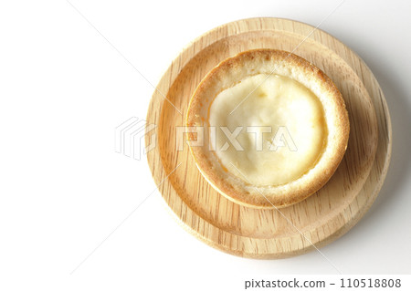 An overhead shot of a bite-sized cheese tart against a white background An overhead shot of a bite-sized cheese tart against a white background 110518808