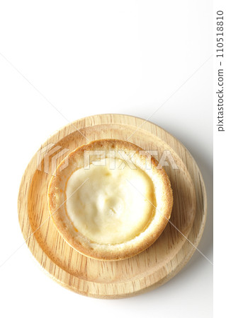 An overhead shot of a bite-sized cheese tart against a white background An overhead shot of a bite-sized cheese tart against a white background 110518810