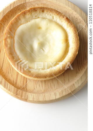 An overhead shot of a bite-sized cheese tart against a white background An overhead shot of a bite-sized cheese tart against a white background 110518814