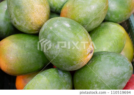 Background mango on top. Lots of exotic mango fruits. Background mango on top. Lots of exotic mango fruits. 110519694