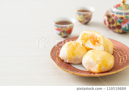 Chinese pastry moon cake with salted egg peanut or Spring Roll pastry with nuts and salted eggs Chinese pastry moon cake with salted egg peanut or Spring Roll pastry with nuts and salted eggs 110519889