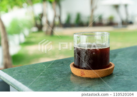 iced americano coffee glass on table iced americano coffee glass on table 110520104