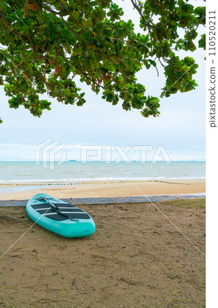 paddle board on beach with sea background paddle board on beach with sea background 110520211