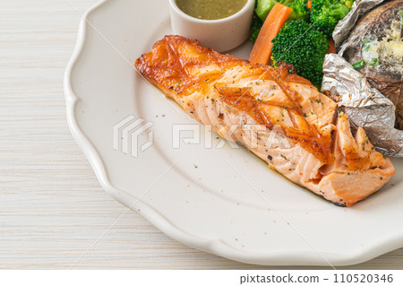 grilled salmon steak with bake potato 110520346