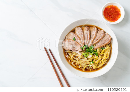 egg noodles with stewed duck in brown soup egg noodles with stewed duck in brown soup 110520391