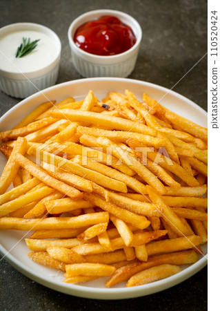 French fries with sour cream and ketchup French fries with sour cream and ketchup 110520424