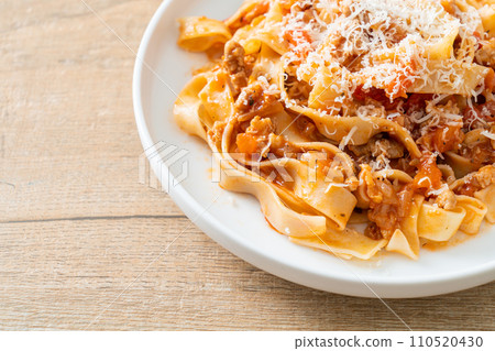 Homemade pasta fettuccine bolognese with cheese 110520430