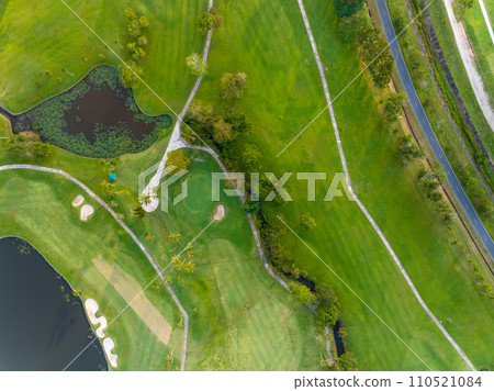 Aerial view of beautiful green golf field fairway and putting green, Top down image for sport background and travel nature background, Amazing green nature view Aerial view of beautiful green golf field fairway and putting green, Top down image for sport background and travel nature background, Amazing green nature view 110521084