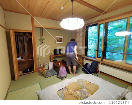 A man relaxing at an inn 110521874