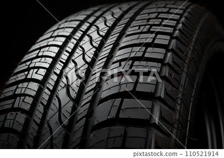 New black tires pile on a dark black background close-up. Tire fitting background with stack of car tires. Copy space. Generative AI 110521914