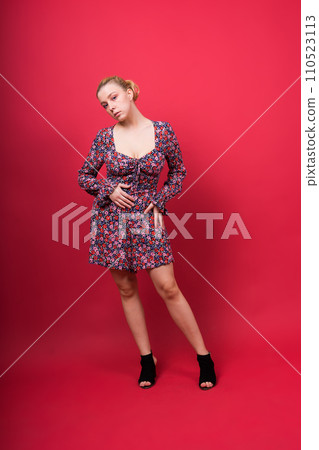 Seductive attractive blonde woman posing in fashionable lingerie in studio 110523113