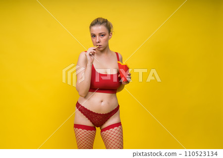 Seductive attractive blonde woman posing in fashionable lingerie in studio Seductive attractive blonde woman posing in fashionable lingerie in studio 110523134