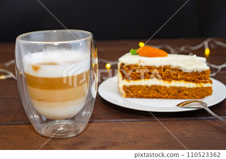 Carrot sponge cake with cream and walnuts and Cappuccino coffee 110523362