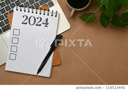 2024 resolutions list in a spiral notebook. Resolutions, plan, goals, checklist, idea concept 2024 resolutions list in a spiral notebook. Resolutions, plan, goals, checklist, idea concept 110523448