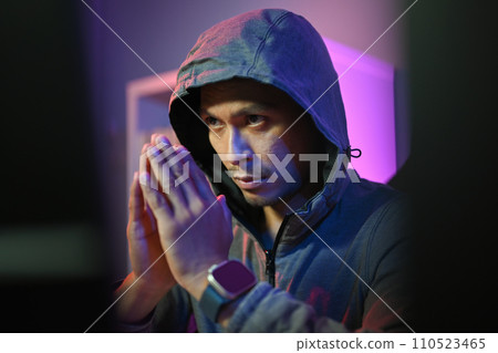 Male hacker in hoodie using computer for attack security to data digital internet network system. Cybersecurity concept Male hacker in hoodie using computer for attack security to data digital internet network system. Cybersecurity concept 110523465